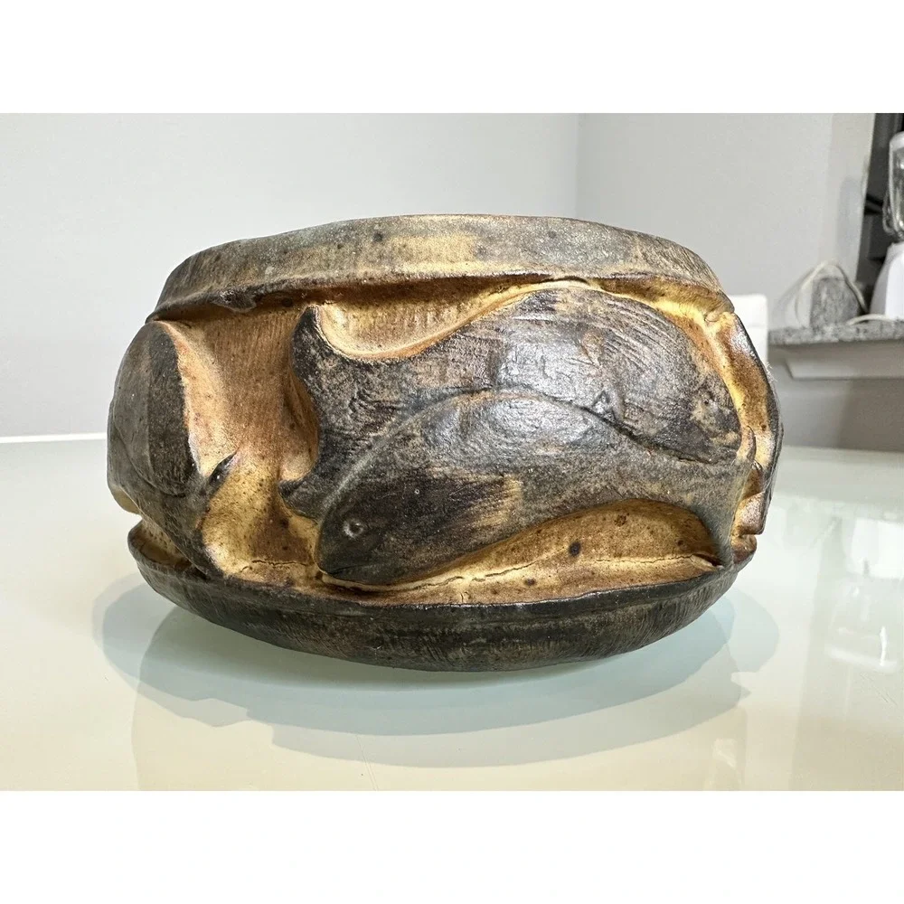 antique stone vase‎ with ornament in the form of fish